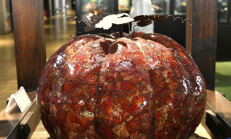 A merchant visits the exhibition hall of a glasswork company in Hejian City, north China's Hebei Province, Feb. 11, 2023. Hejian City is famous for its glasswork making industry. Now, there are more than 200 glasswork making companies and over 60,000 staff members involved in the industry in Hejian. The annual output of the glasswork reached nearly 10 billion yuan (about 1.47 billion U.S. dollars) and the glasswork has been exported to over 50 countries and regions. Photo: Xinhua