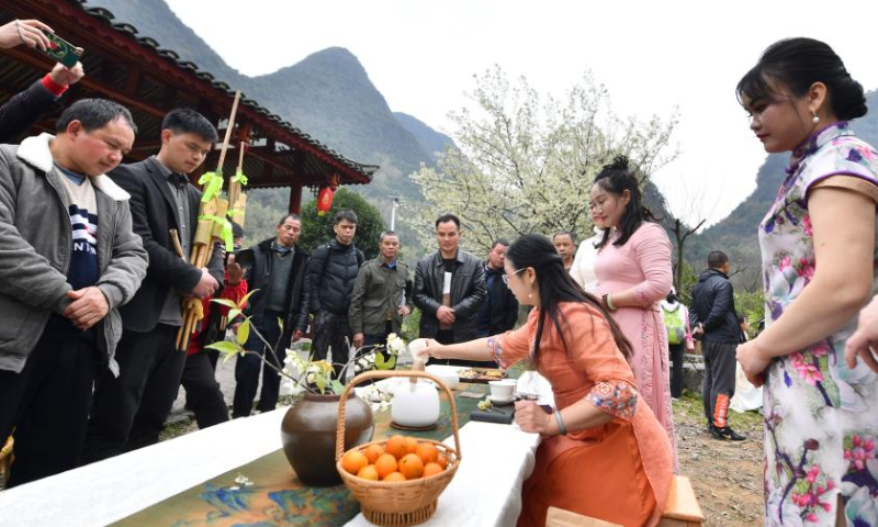 Villagers from Wuying Village watch a demonstration of tea-making techniques in Tongban hamlet, Dongqi Township of Rong'an County, south China's Guangxi Zhuang Autonomous Region, Feb. 18, 2023. Photo: Xinhua