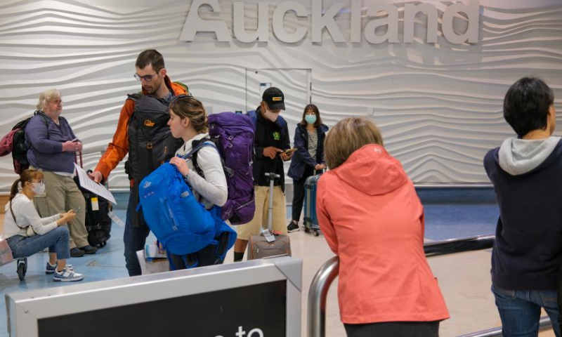 Stranded passengers are pictured as their jet services have been cancelled due to severe weather conditions at the Auckland Airport in Auckland, New Zealand, Feb. 12, 2023. Twenty severe weather warnings and watches are in place as tropical cyclone Gabrielle is landing far north of New Zealand and is expected to swipe through most parts of the North Island from Sunday. Photo: Xinhua