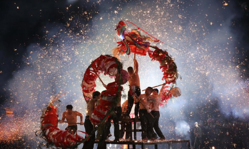 People perform dragon dance in Chengguan Town of Shibing County in Qiandongnan Miao and Dong Autonomous Prefecture, southwest China's Guizhou Province, Feb. 4, 2023. Various events are held across the country to celebrate the Lantern Festival, the 15th day of the first month of the Chinese lunar calendar, which falls on Feb. 5 this year. Photo: Xinhua
