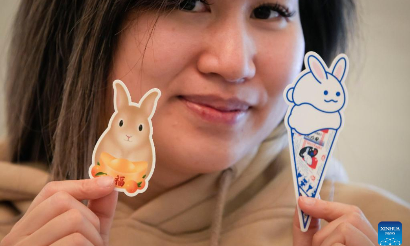 A vendor displays stickers themed on the Year of the Rabbit at the Lunar New Year Market hosted by University of British Columbia (UBC) Botanical Garden in Vancouver, British Columbia, Canada, on Jan. 14, 2023. (Photo by Liang Sen/Xinhua)