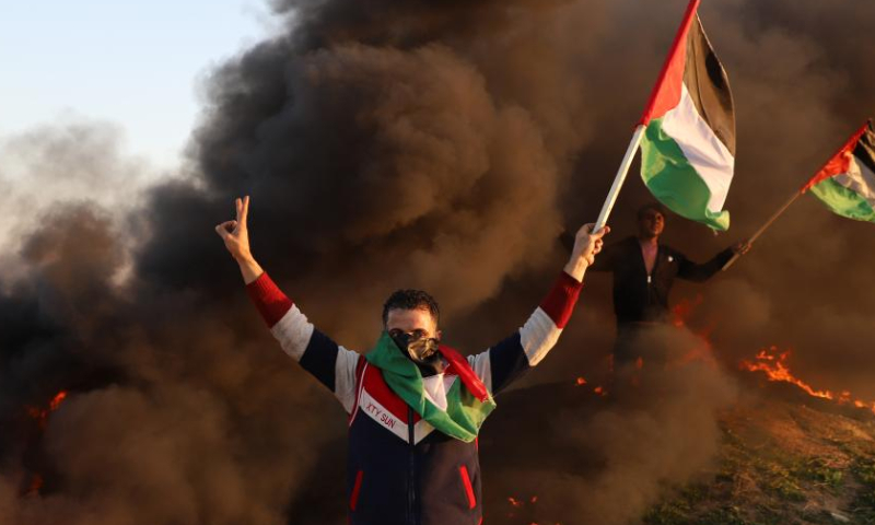 Palestinians take part in a demonstration following the killing of nine Palestinians by Israeli forces near the Gaza-Israel border, east of Gaza City, on Jan. 26, 2023. Israeli forces killed on Thursday at least nine Palestinians, including an elderly woman, during a raid in the occupied West Bank, Palestinian sources said, amid escalating violence in the region. Photo: Xinhua