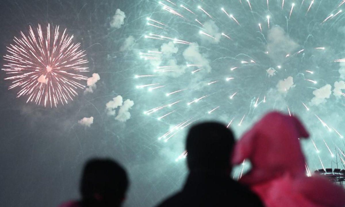 People watch a fireworks show to greet the Spring Festival at a square of the Olympic Sports Center in Xi'an, northwest China's Shaanxi Province, Jan 21, 2023. Photo:Xinhua