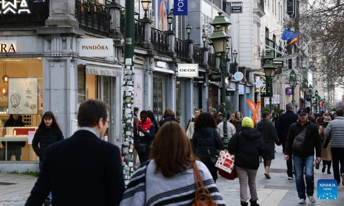 Pedestrians walk on a business street in Brussels, Belgium, Jan 3, 2023. Photo:Xinhua