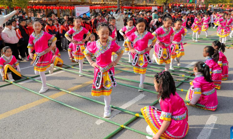 Students take part in a bamboo dance at a primary school in Huaibei, east China's Anhui Province, Feb. 4, 2023. The Lantern Festival, the 15th day of the first month of the Chinese lunar calendar, falls on Feb. 5 this year. Various folk cultural activities were held across the country to welcome the upcoming festival. Photo: Xinhua