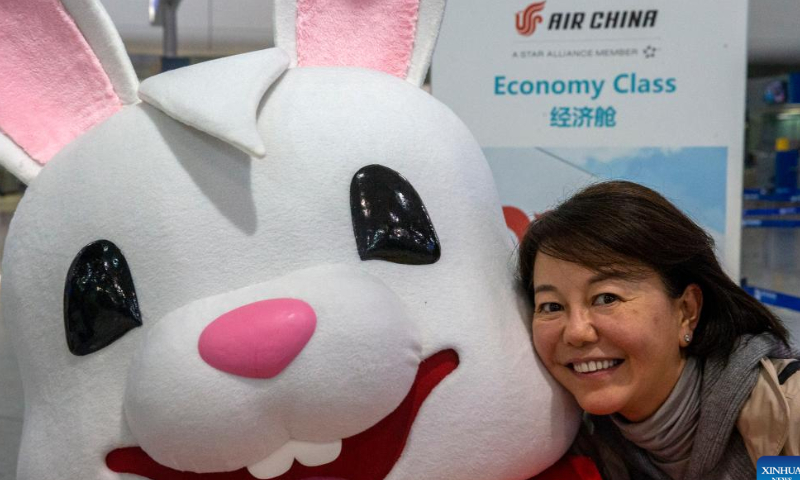A passenger poses for a photo with a staff in rabbit costume at the Athens International Airport in Athens, Greece, Jan. 26, 2023. The Athens International Airport has unveiled the Rabbit Mascot to celebrate the Chinese Lunar New Year of the Rabbit. Photo: Xinhua