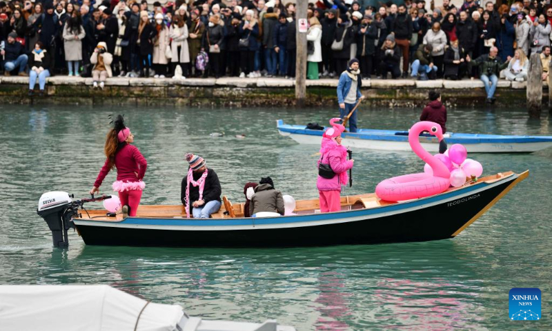 People attend a water parade of the Venice Carnival in Venice, Italy, on Feb. 5, 2023. The Venice Carnival 2023 kicked off in the Italian lagoon city on Feb. 4, and will last until Feb. 21. (Xinhua/Jin Mamengni)