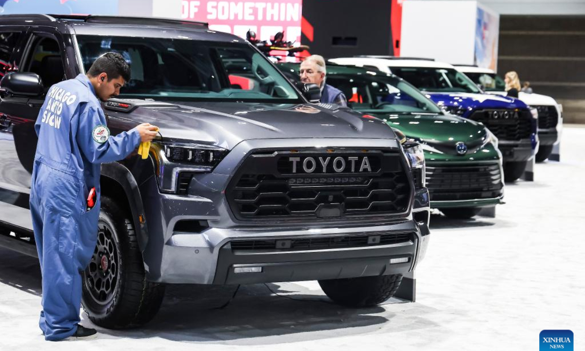 A staff member cleans a Toyota Sequoia vehicle on display during the media preview of Chicago Auto Show in Chicago, the United States, Feb 9, 2023. Photo:Xinhua