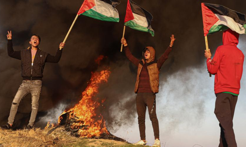 Palestinians take part in a demonstration following the killing of nine Palestinians by Israeli forces near the Gaza-Israel border, east of Gaza City, on Jan. 26, 2023. Israeli forces killed on Thursday at least nine Palestinians, including an elderly woman, during a raid in the occupied West Bank, Palestinian sources said, amid escalating violence in the region. Photo: Xinhua