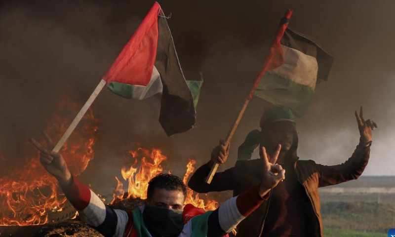 Palestinians take part in a demonstration following the killing of nine Palestinians by Israeli forces near the Gaza-Israel border, east of Gaza City, on Jan. 26, 2023. Israeli forces killed on Thursday at least nine Palestinians, including an elderly woman, during a raid in the occupied West Bank, Palestinian sources said, amid escalating violence in the region. Photo: Xinhua