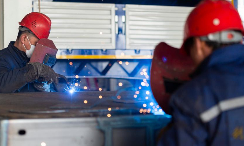 Employees work at the Heihe Liyuanda Special Automobile Manufacturing Co., Ltd. in the Heihe Area of China (Heilongjiang) Pilot Free Trade Zone in northeast China's Heilongjiang Province, Feb. 11, 2023. Recently, enterprises in the Heihe Area of China (Heilongjiang) Pilot Free Trade Zone have been busy with production to meet the orders and to make a good start in the first quarter of 2023. Photo: Xinhua