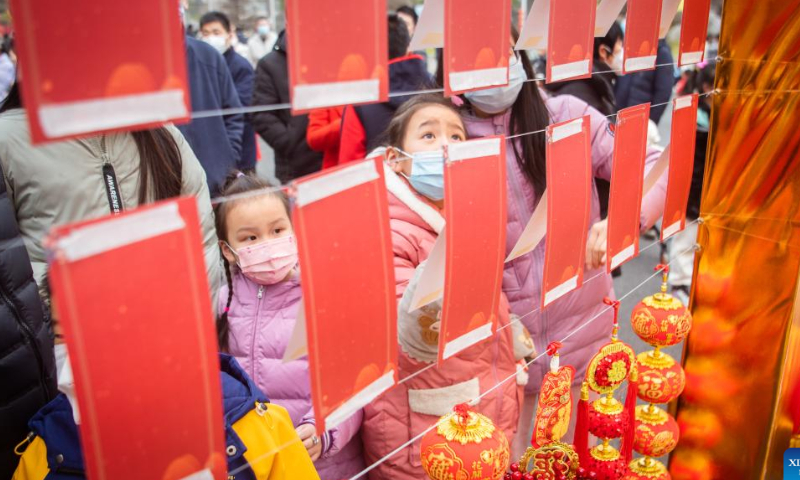 Children guess lantern riddles at the Wuhan Sports Center in Wuhan, central China's Hubei Province, Feb. 4, 2023. The Lantern Festival, the 15th day of the first month of the Chinese lunar calendar, falls on Feb. 5 this year. Various folk cultural activities were held across the country to welcome the upcoming festival. Photo: Xinhua