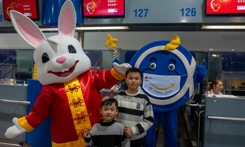 Children pose for a photo with staff members in costumes at the Athens International Airport in Athens, Greece, Jan. 26, 2023. The Athens International Airport has unveiled the Rabbit Mascot to celebrate the Chinese Lunar New Year of the Rabbit. Photo: Xinhua