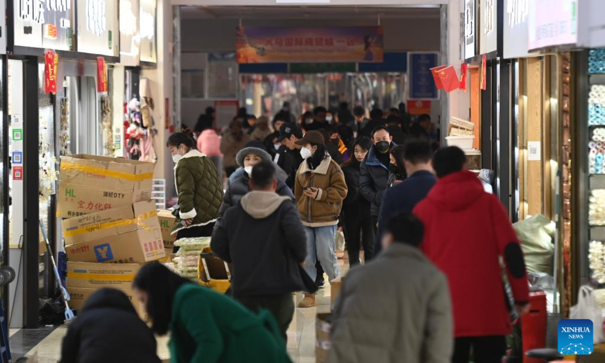 People shop at the Yiwu International Trade Market in Yiwu City, east China's Zhejiang Province, Feb 2, 2023. About 75,000 merchants at the Yiwu International Trade Market on Thursday welcomed their first business day in the Year of the Rabbit. Photo:Xinhua