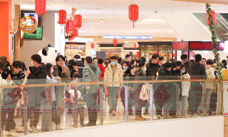 Residents are seen at a shopping mall in Lianyungang, East China's Jiangsu Province, on January 23, 2023 during the Spring Festival holidays. Photo: VCG