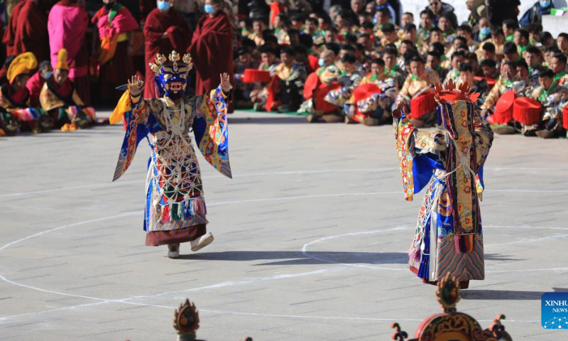 Masked monks perform religious dance during a ritual at the Labrang Monastery in Xiahe County, northwest China's Gansu Province, Feb. 4, 2023. The ritual was held here on Saturday to pray for good luck in the new year. Photo: Xinhua