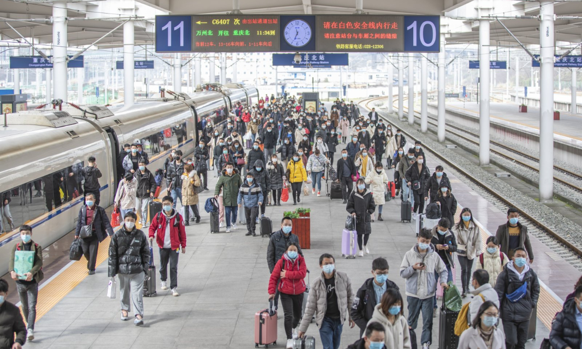 Passengers are seen on a platform at Chongqingbei Railway Station in Chongqing, southwest China, Feb 17, 2021. Photo:Xinhua