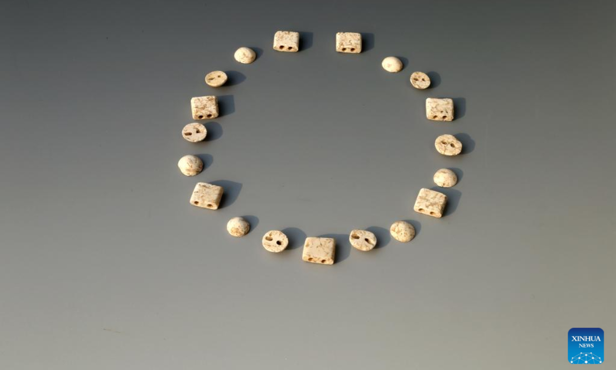 This file photo taken on Nov 16, 2021 shows some beads of a neck decoration unearthed from the Sitai ruins in Shangyi County, north China's Hebei Province. Photo:Xinhua