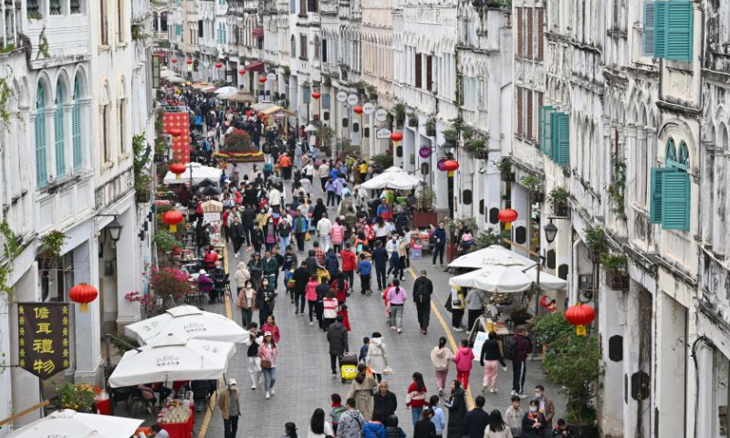 Tourists visit an exhibition at the Qilou ancient street during the Spring Festival holiday in Haikou, south China's Hainan Province, Jan. 27, 2023. Photo: Xinhua