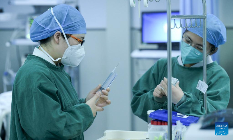 Medical staff work at the emergency department of the Second Affiliated Hospital of Anhui Medical University in Hefei, east China's Anhui Province, Jan. 21, 2023. Medical staff stick to their posts during the Spring Festival holiday. (Xinhua/Zhou Mu)