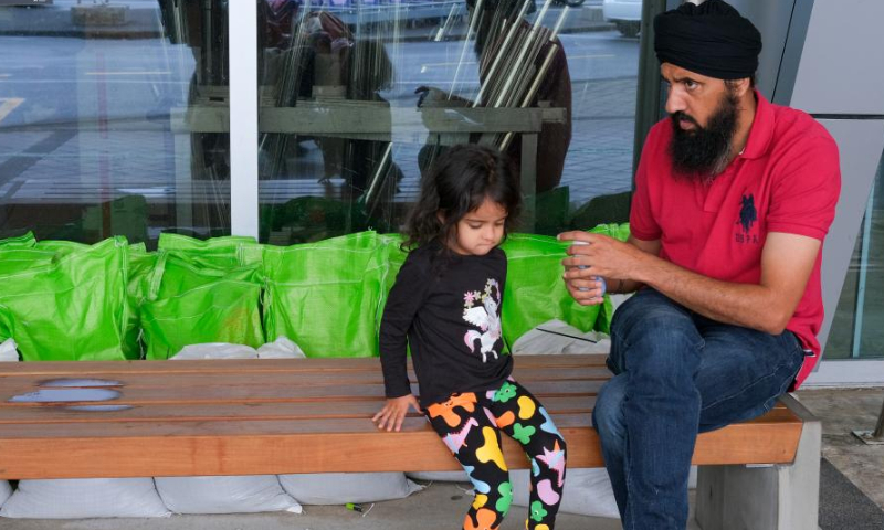 Stranded passengers are pictured as their jet services have been cancelled due to severe weather conditions at the Auckland Airport in Auckland, New Zealand, Feb. 12, 2023. Twenty severe weather warnings and watches are in place as tropical cyclone Gabrielle is landing far north of New Zealand and is expected to swipe through most parts of the North Island from Sunday. Photo: Xinhua