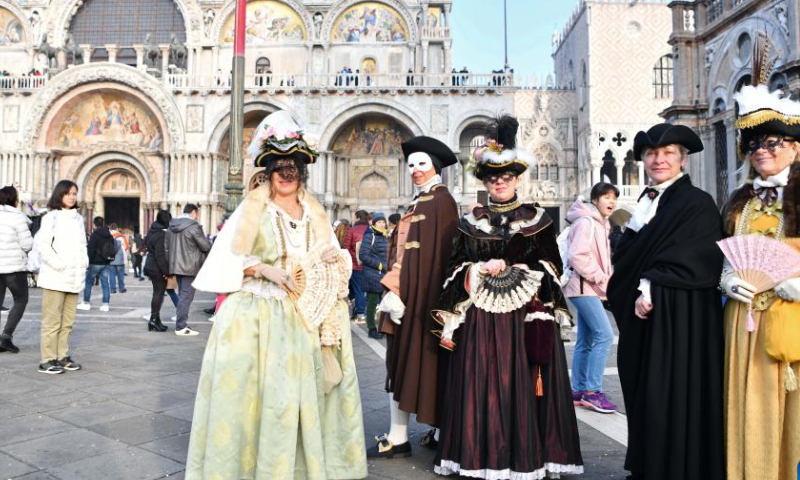 Revelers pose during the Venice Carnival in Venice, Italy, on Feb. 4, 2023. The Venice Carnival 2023 kicked off in the Italian lagoon city on Saturday, and will last until Feb. 21. Photo: Xinhua