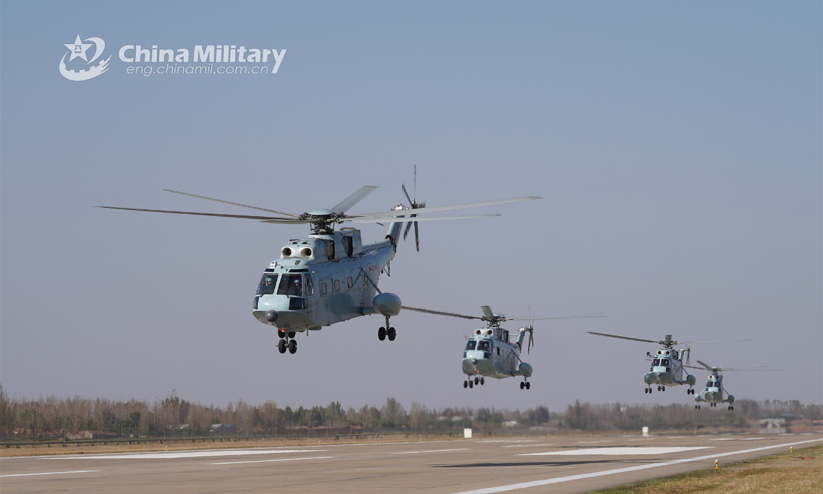 Helicopters attached to a brigade of the PLA Navy's Marine Corps lift off for a round-the-clock flight training exercise on January 8, 2023. Photo: China Military