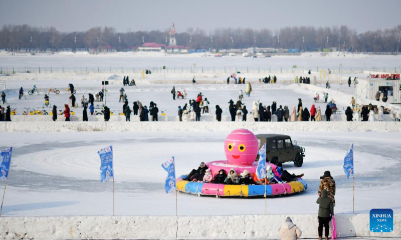 People have fun at Harbin Songhua River Ice and Snow Carnival in Harbin, northeast China's Heilongjiang Province, Jan. 22, 2023. (Xinhua/Wang Jianwei)
