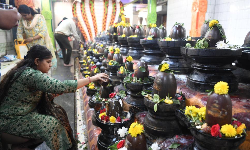 Indian Hindu devotees pour milk on Shiva linga on the occasion of Maha Shivaratri festival, in Bengaluru, India, Feb. 18, 2023. Maha Shivaratri is a Hindu festival celebrated annually in honor of Lord Shiva. Photo: Xinhua