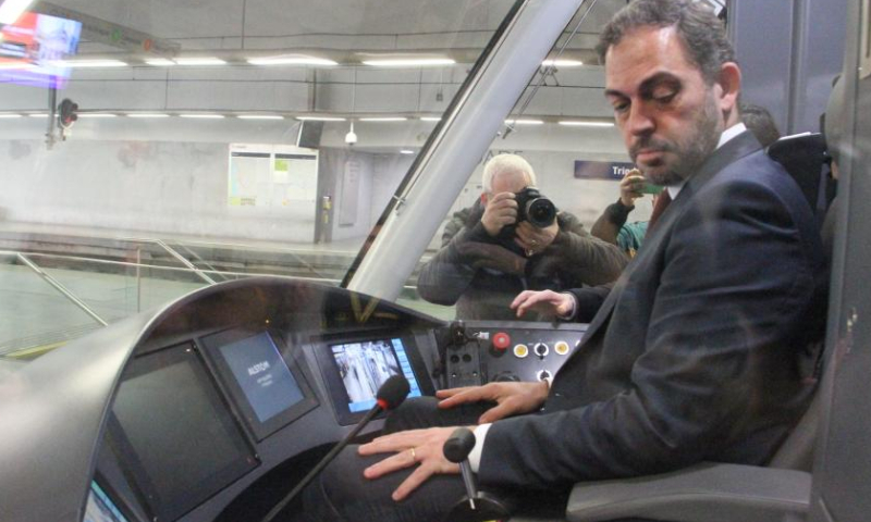 Portuguese Minister of Environment and Climate Action Duarte Cordeiro sits in the driver's cab of a China-made metro train inside the Trindade Metro Station at the center of Porto, Portugal, Feb. 11, 2023. First of the 18-set metro trains made by Chinese company was delivered to the Porto Metro company of Portugal on Saturday. Photo: Xinhua