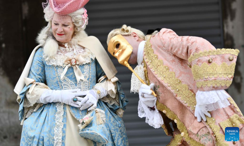 Revelers pose during the Venice Carnival in Venice, Italy, on Feb. 5, 2023. The Venice Carnival 2023 kicked off in the Italian lagoon city on Feb. 4, and will last until Feb. 21. (Xinhua/Jin Mamengni)