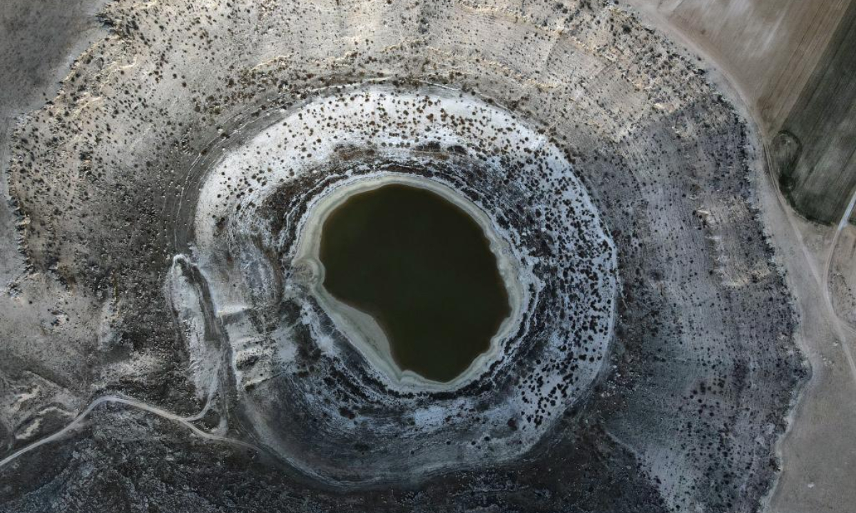 This aerial photo taken on Jan 28, 2023 shows sinkholes in Konya, Türkiye. The number of sinkholes is alarmingly increasing in Türkiye's drought-stricken central Konya province, putting farmers' livelihoods in danger amid uncontrolled water use. Photo:Xinhua