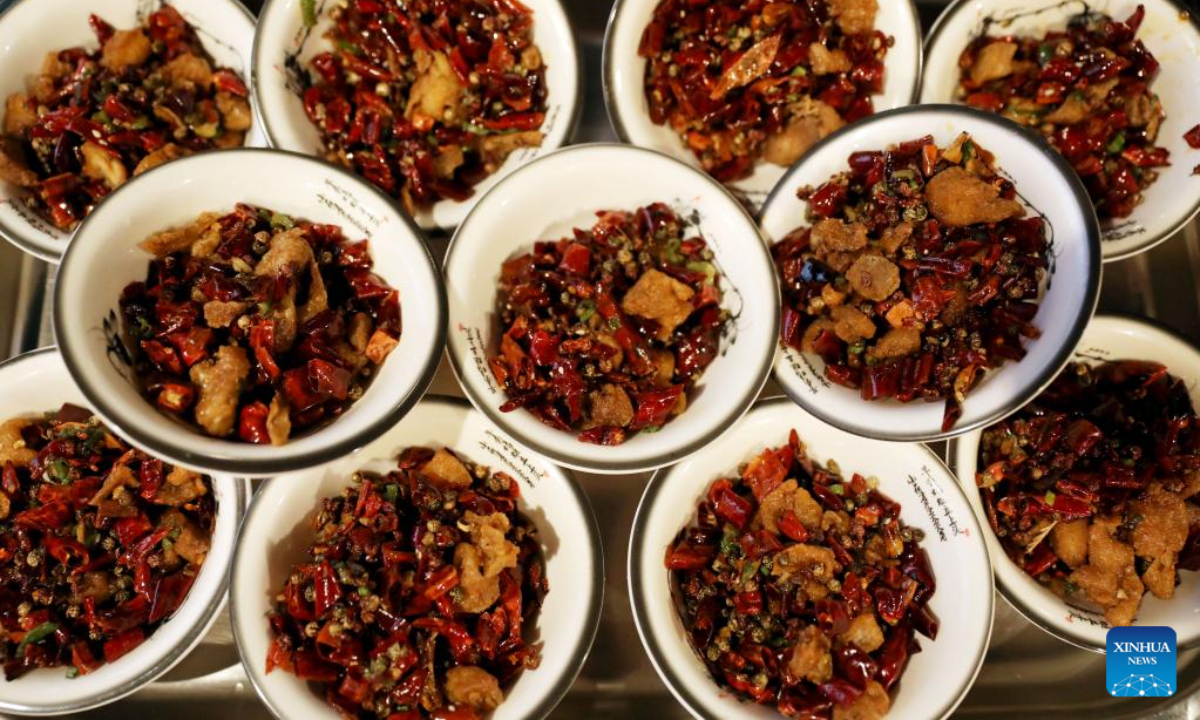 Photo taken on Feb 2, 2023 shows fragrant chicken with chilies during