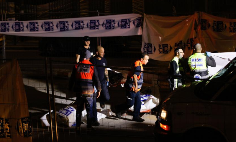 Israeli police and emergency service members work at the scene of a shooting attack in a settlement in East Jerusalem, on Jan. 27, 2023. At least eight people were killed and 10 others injured in a shooting attack in a settlement in East Jerusalem on Friday night, the Israeli Foreign Ministry said in a tweet. Photo: Xinhua