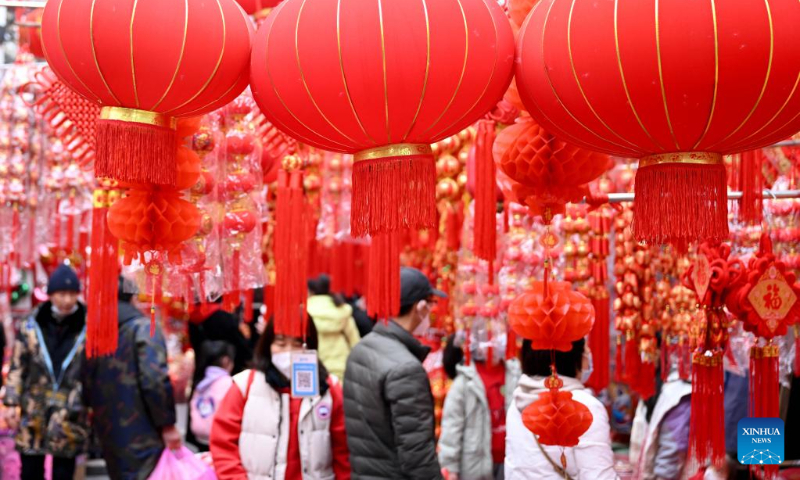People shop for decorations for the upcoming Chinese New Year in Hefei, east China's Anhui Province, Jan. 5, 2023. (Xinhua/Huang Bohan)