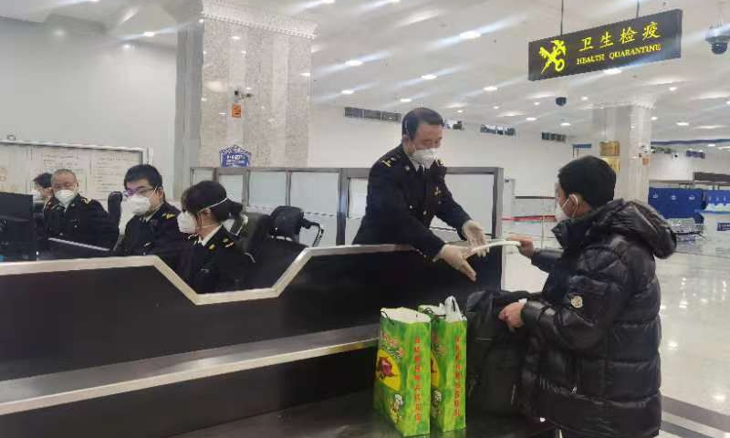 Customs officers at Manzhouli port inspect the first batch of people entering the country after the passenger customs clearance restored at the Manzhouli highway port. Photo: In courtesy of Manzhouli port.