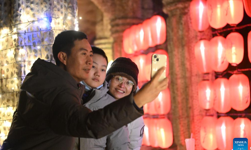 People take a selfie at a lantern show during the Spring Festival holiday in Tianjin, north China, Jan. 26, 2023. Photo: Xinhua