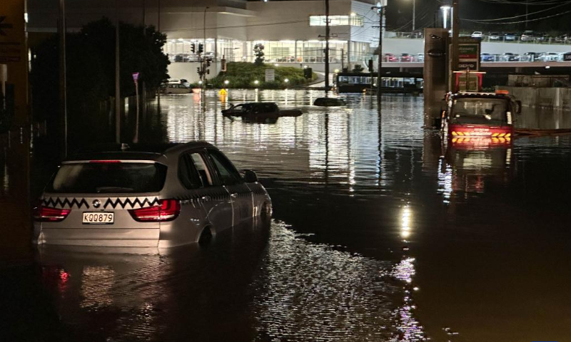 Vehicles drive on a flooded street in Auckland, New Zealand, Jan. 27, 2023. A state of emergency was declared in Auckland on Friday as heavy rains caused widespread flooding in New Zealand's biggest city. Photo: Xinhua