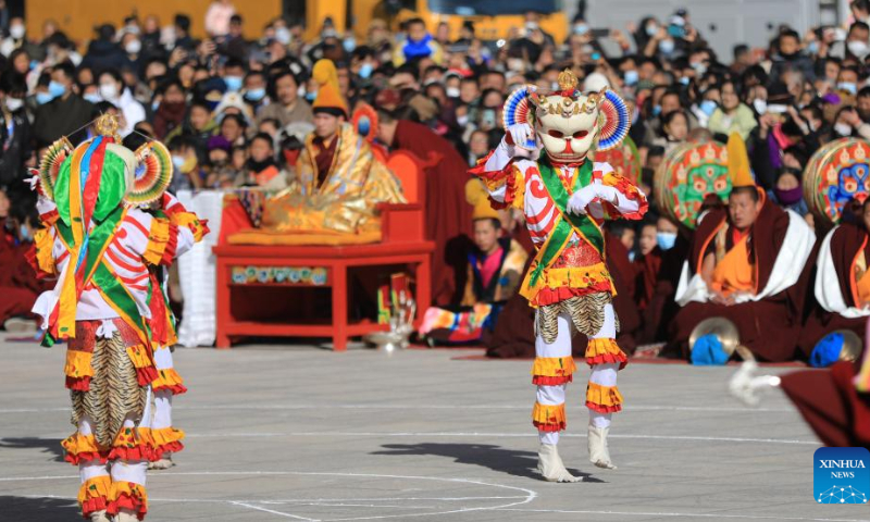 Masked monks perform religious dance during a ritual at the Labrang Monastery in Xiahe County, northwest China's Gansu Province, Feb. 4, 2023. The ritual was held here on Saturday to pray for good luck in the new year. Photo: Xinhua