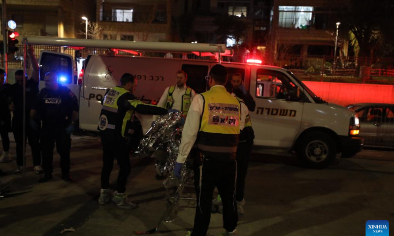 Israeli police and emergency service members work at the scene of a shooting attack in a settlement in East Jerusalem, on Jan. 27, 2023. At least eight people were killed and 10 others injured in a shooting attack in a settlement in East Jerusalem on Friday night, the Israeli Foreign Ministry said in a tweet. Photo: Xinhua