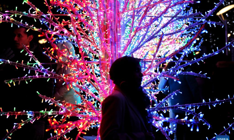People visit a winter light show at Canary Wharf in London, Britain, on Jan. 27, 2023. Photo: Xinhua