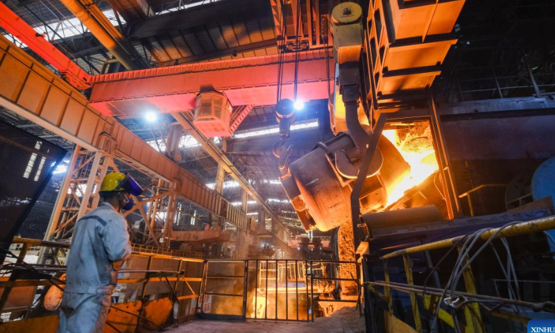 A staff member checks the operation of steel furnace at a special steel company in Xinfeng Town of Nanhu District, Jiaxing, east China's Zhejiang Province, Jan. 26, 2023. Many companies in Nanhu District of Jiaxing have sped up production during the Spring Festival holiday to ensure delivery of orders, while offering cash gifts and other rewards for employees. Photo: Xinhua