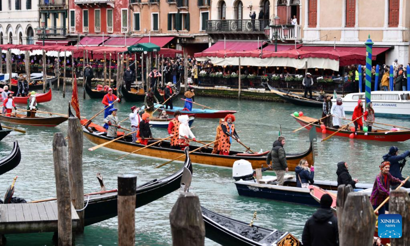 People attend a water parade of the Venice Carnival in Venice, Italy, on Feb. 5, 2023. The Venice Carnival 2023 kicked off in the Italian lagoon city on Feb. 4, and will last until Feb. 21. (Xinhua/Jin Mamengni)