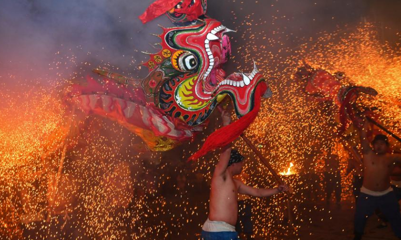 Folk artists perform a fire dragon dance in Baojing County, central China's Hunan Province, Feb. 4, 2023. Various events are held across the country to celebrate the Lantern Festival, the 15th day of the first month of the Chinese lunar calendar, which falls on Feb. 5 this year. Photo: Xinhua