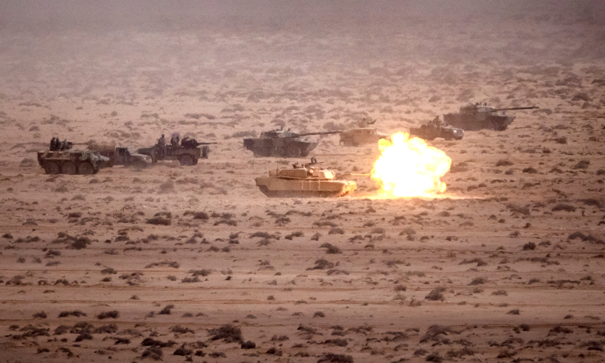 A US army M1 Abrams main battle tank fires a round during the second annual 