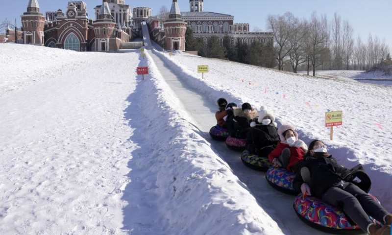 People enjoy themselves at the Volga Manor in Harbin, northeast China's Heilongjiang Province, Jan. 26. 2023. Heilongjiang has attracted legions of tourists during the Spring Festival holiday. Photo: Xinhua