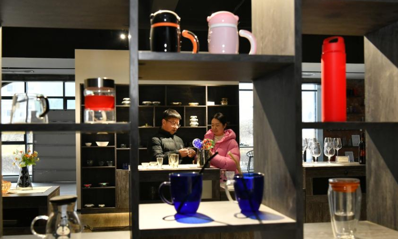 Merchants visit the exhibition hall of a glasswork company in Hejian City, north China's Hebei Province, Feb. 11, 2023. Hejian City is famous for its glasswork making industry. Now, there are more than 200 glasswork making companies and over 60,000 staff members involved in the industry in Hejian. The annual output of the glasswork reached nearly 10 billion yuan (about 1.47 billion U.S. dollars) and the glasswork has been exported to over 50 countries and regions. Photo: Xinhua