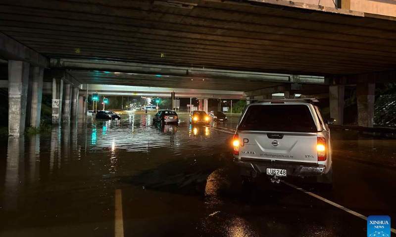 Vehicles drive on a flooded street in Auckland, New Zealand, Jan. 27, 2023. A state of emergency was declared in Auckland on Friday as heavy rains caused widespread flooding in New Zealand's biggest city. Photo: Xinhua