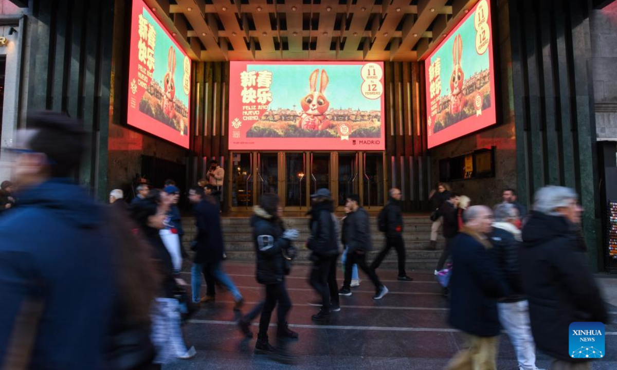 Chinese New Year posters are displayed on electronic screens in Madrid, Spain, Jan 21, 2023. Photo:Xinhua