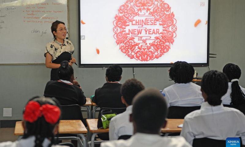 A Chinese lecturer from the Confucius Institute at the University of Namibia gives a lecture on traditions related to the Chinese New Year in Windhoek, Namibia, Jan. 27, 2023. The Confucius Institute at the University of Namibia on Friday acquainted local students with traditions related to the Chinese New Year, or the Spring Festival. Photo: Xinhua